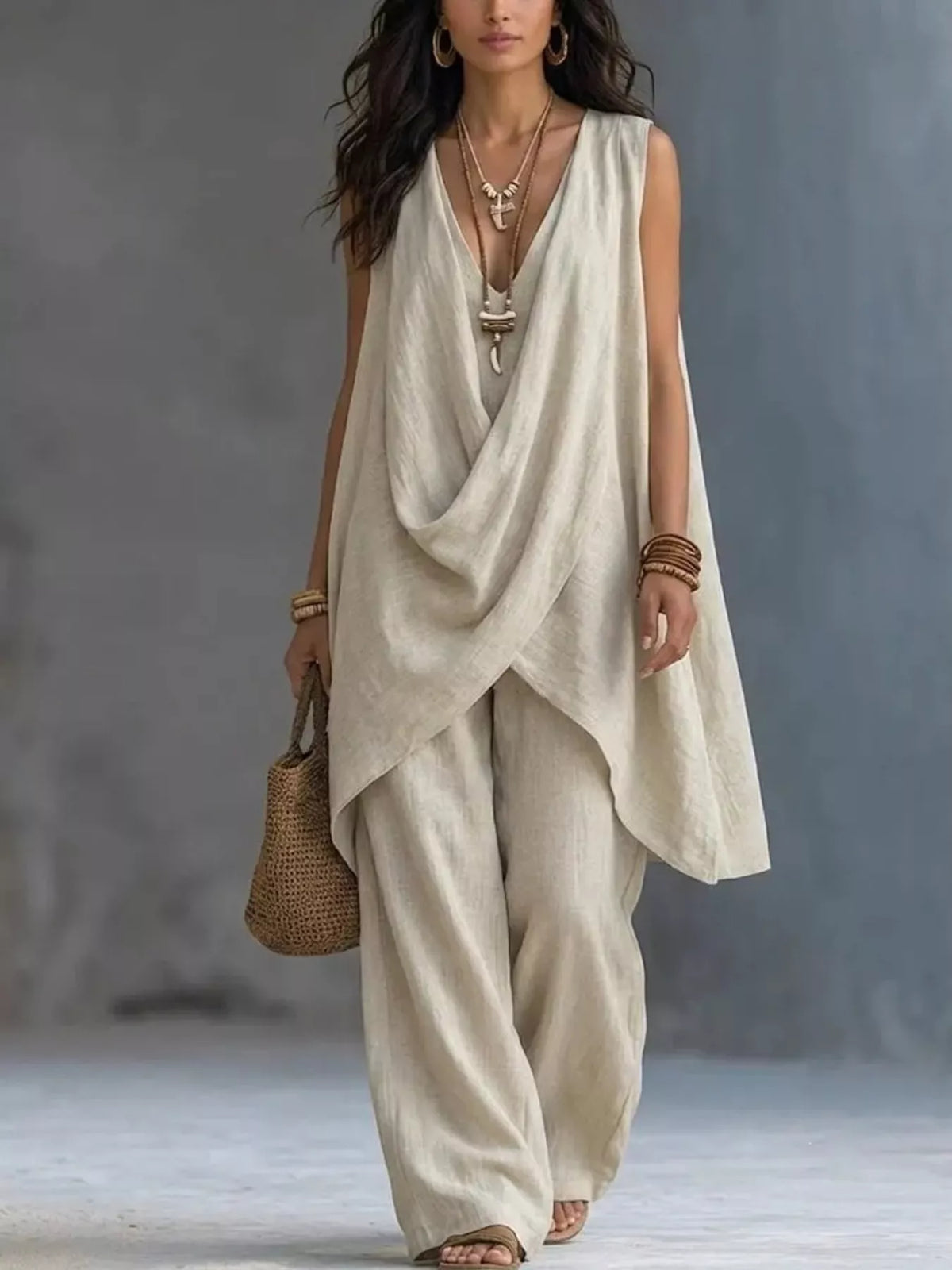 Plush Fashion Hub sleeveless asymmetrical top with wide-leg pants set, featuring a modern, stylish design in soft fabric.