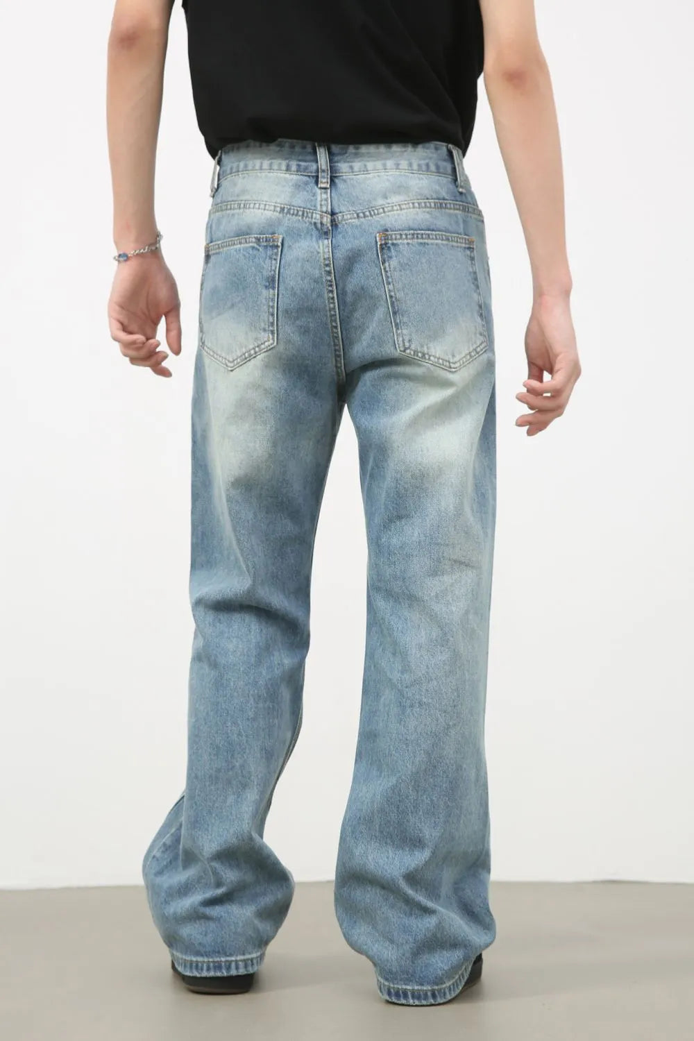 Men's distressed denim jeans by Plush Fashion Hub, showing fit, faded areas, and classic five-pocket style.