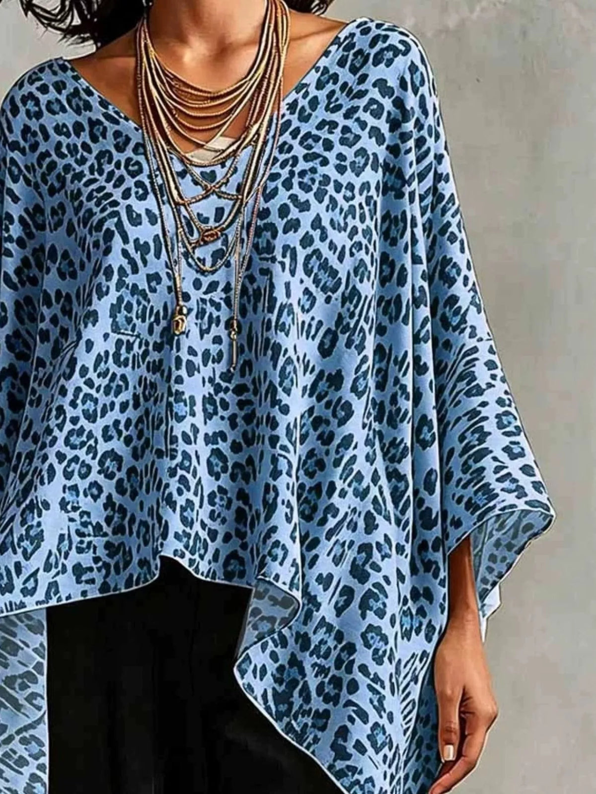 Plus size leopard print asymmetrical hem top from Plush Fashion Hub, featuring a stylish, flowing design and bold animal print.