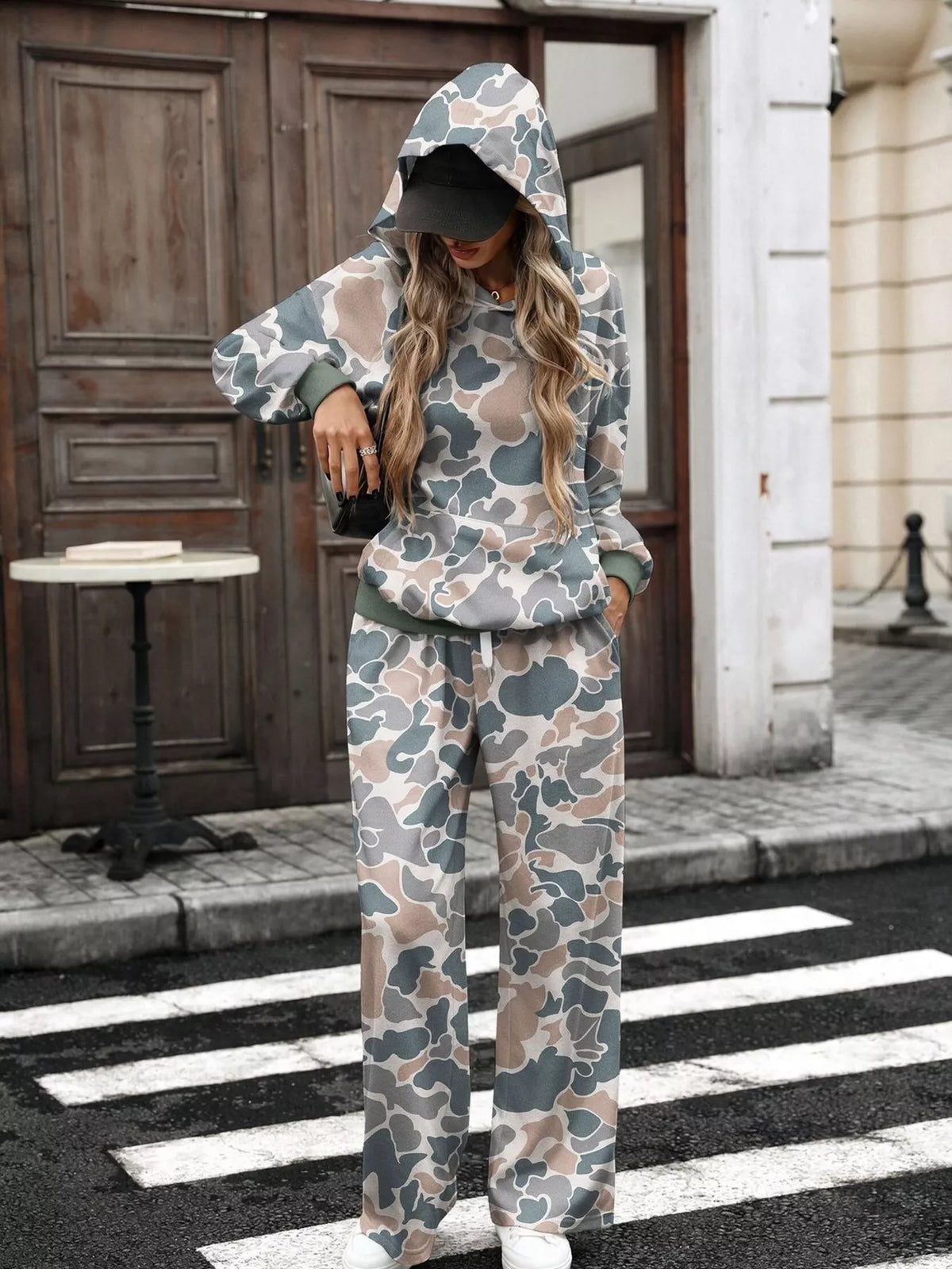 Printed long sleeve hoodie and pants set by Trendsi, featuring a comfortable, stylish design with colorful print details.