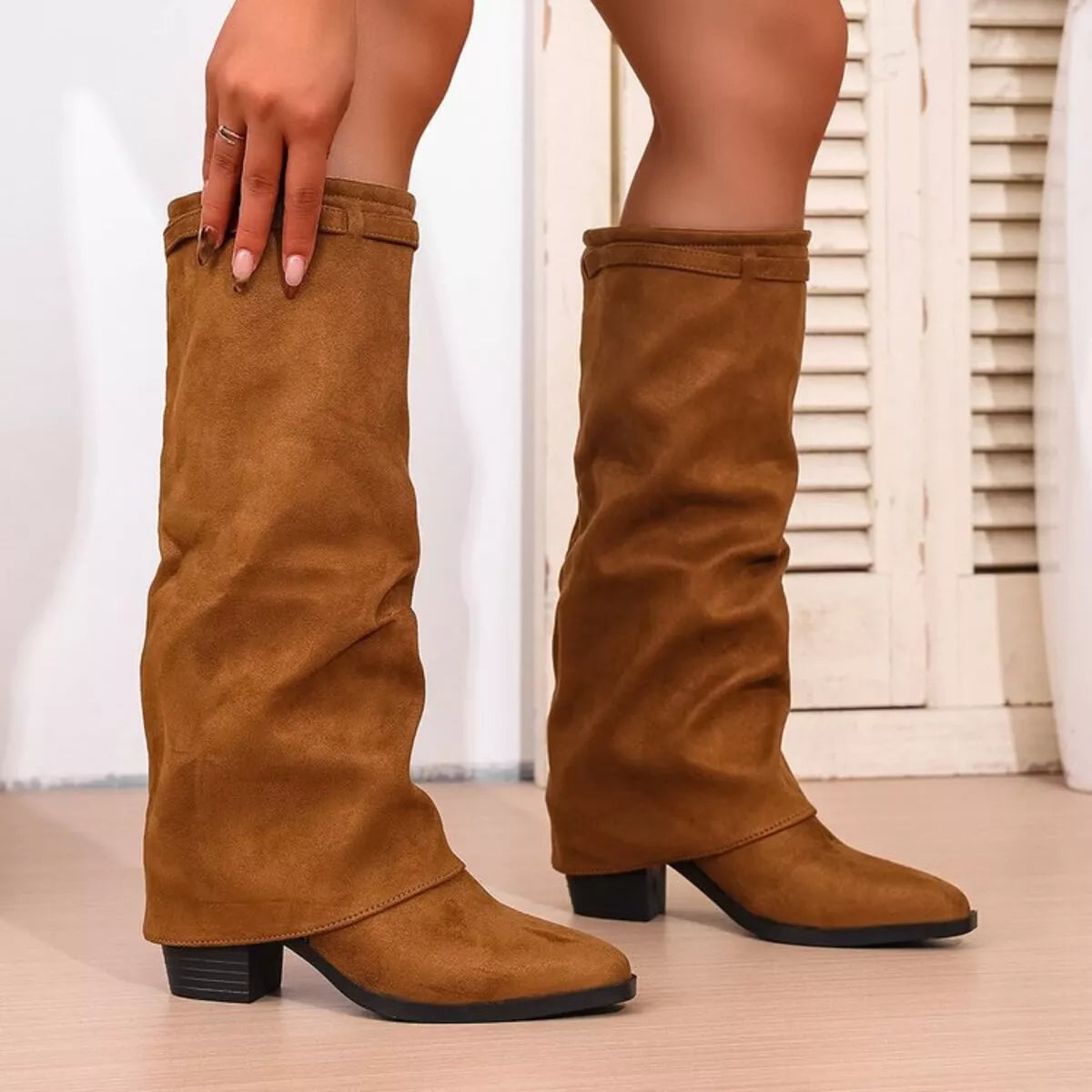 Point toe block heels boots by Trendsi, stylish footwear featuring a sleek design and sturdy block heel for versatile wear.