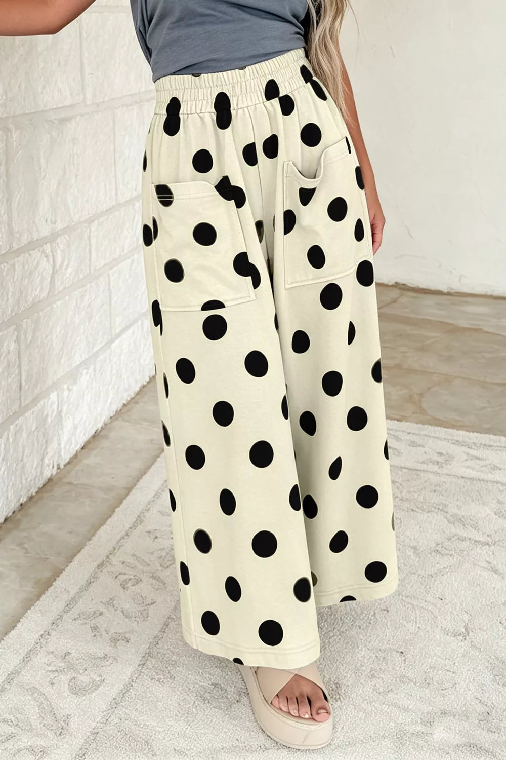 Polka dot wide leg casual pants with elastic waist from Trendsi, featuring a relaxed fit and stylish polka dot pattern.