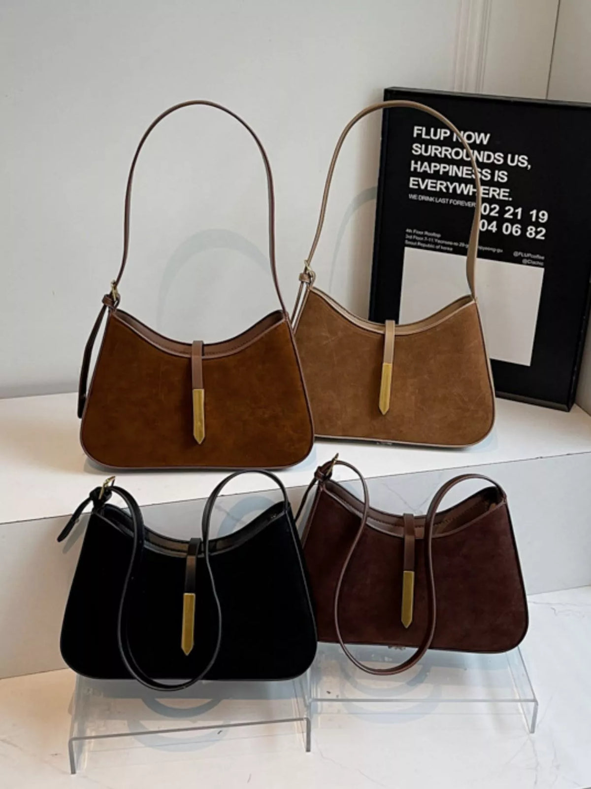Adjustable strap shoulder bag from Plush Fashion Hub showing a stylish bag with a sleek design and versatile carry strap.