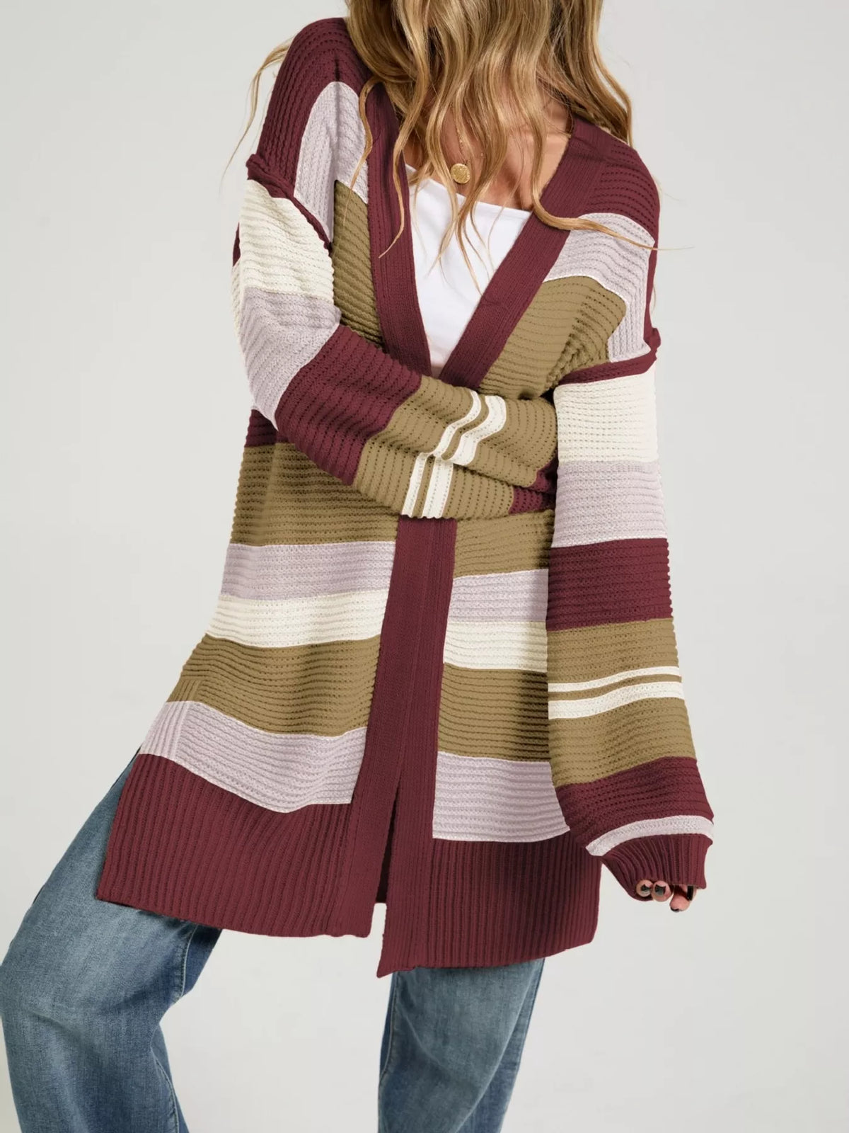Color block striped open front cardigan by Trendsi featuring vibrant color blocks and a relaxed, casual style.