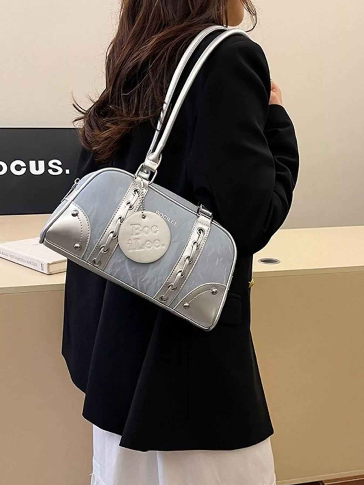 Plush Fashion Hub top handle shoulder bag with sleek design, featuring a structured silhouette and textured material.