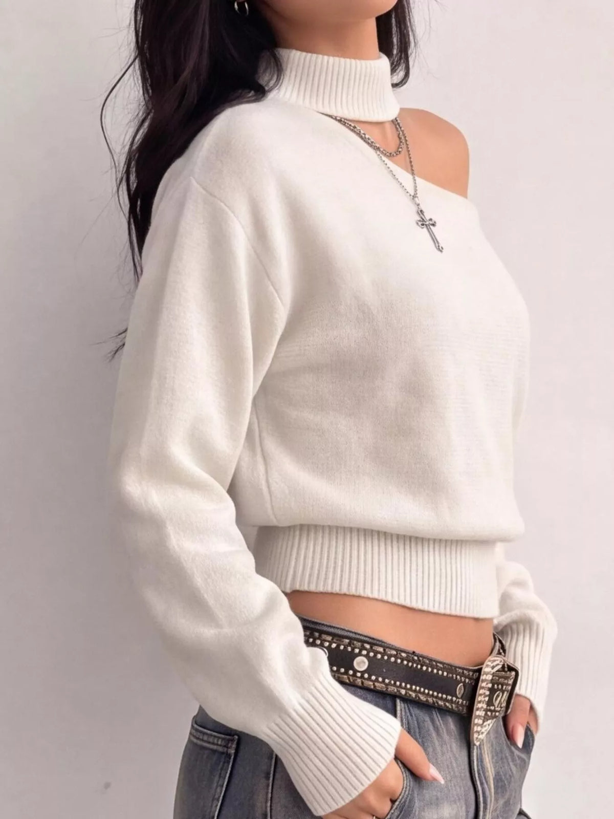 Cold-shoulder dropped shoulder sweater by Trendsi featuring a cozy knit fabric and stylish cut-out shoulder design.