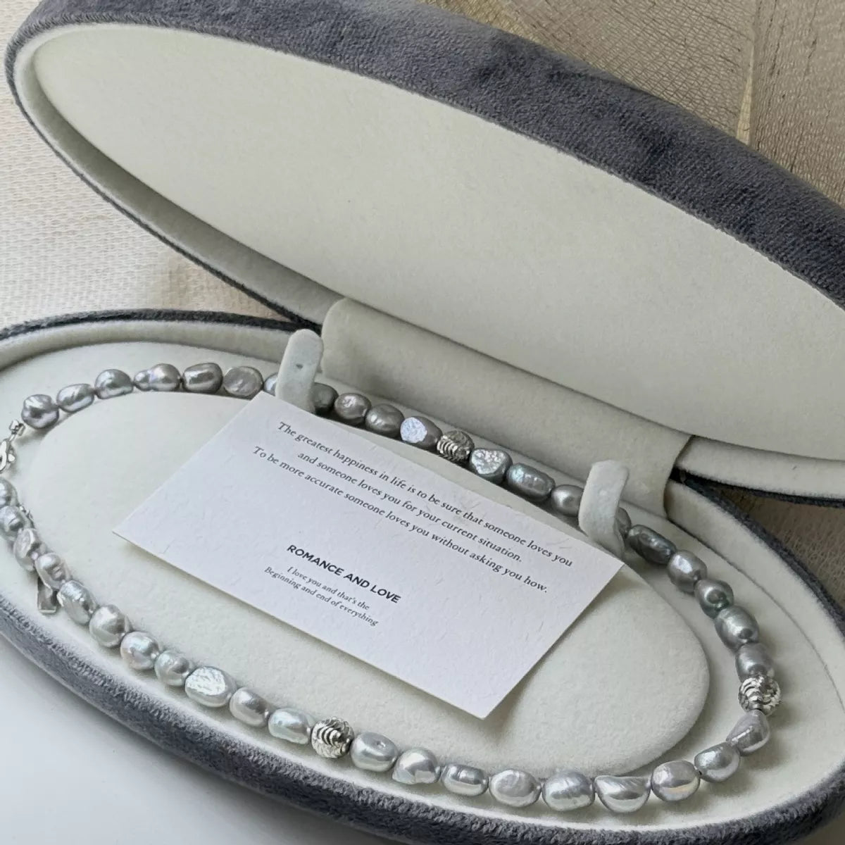 Elegant pearl choker necklace from Plush Fashion Hub featuring a classic string of white pearls on a delicate jewelry chain.