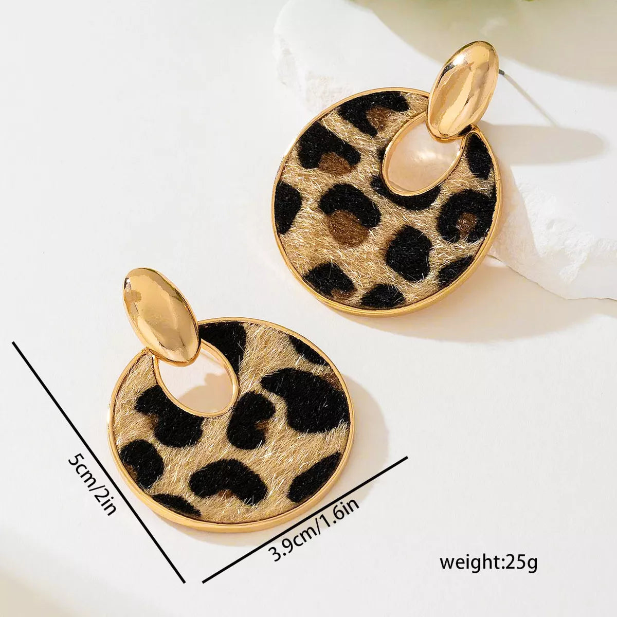 Leopard print circle dangle earrings from Plush Fashion Hub featuring gold-toned hooks and bold animal print design.