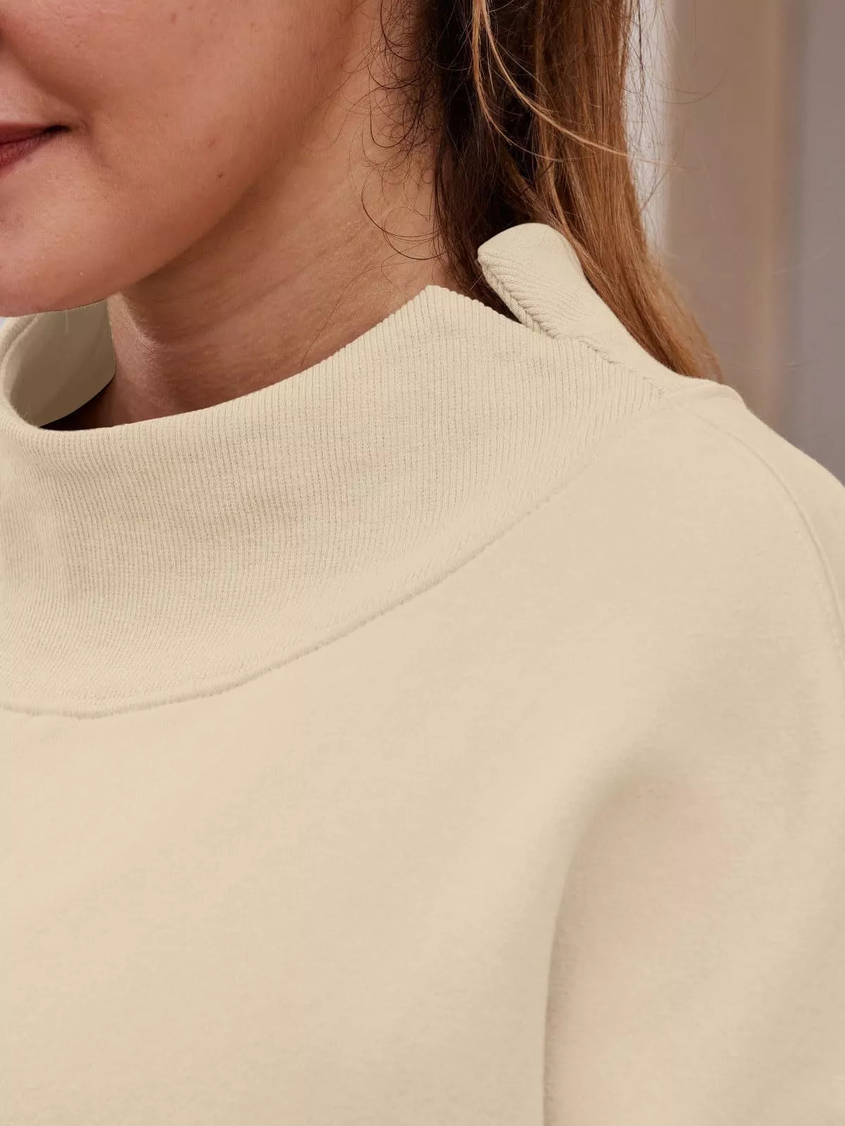 Women’s oversized plush fashion hub mock neck sweatshirt with dropped shoulders, casual style, and pullover design.