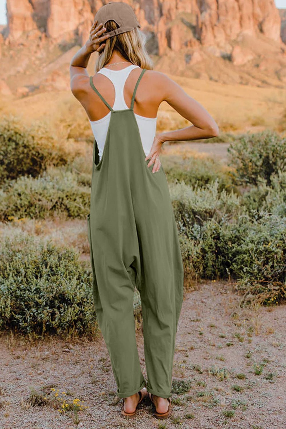 Women’s sleeveless V-neck jumpsuit by Plush Fashion Hub featuring lightweight fabric, casual style, and practical pockets.
