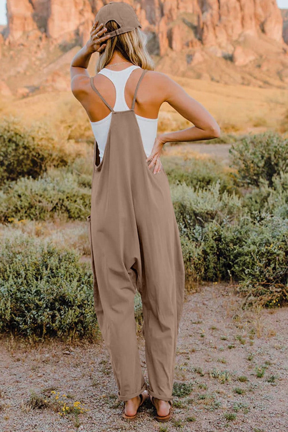 Women’s sleeveless V-neck casual jumpsuit with pockets, lightweight and comfortable, by Plush Fashion Hub, shown full length.