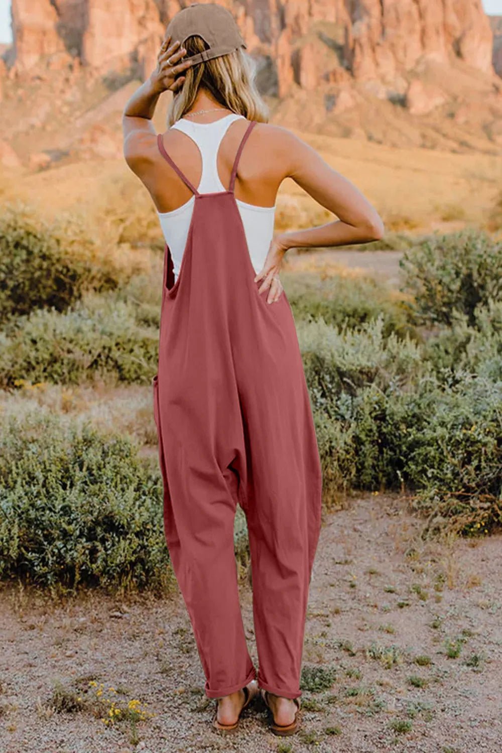 Women’s sleeveless V-neck jumpsuit with pockets, lightweight casual romper by Plush Fashion Hub, shown in full size.