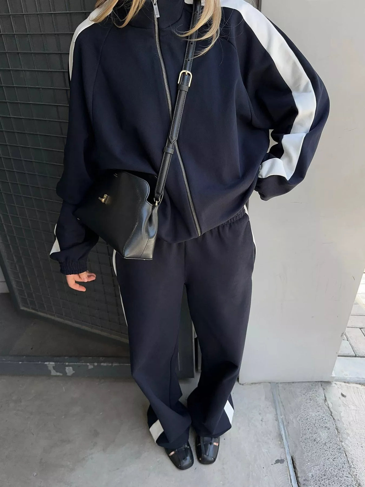 Plush Fashion Hub zip-up long sleeve tracksuit set featuring a comfortable fit and stylish design, shown in a front view.