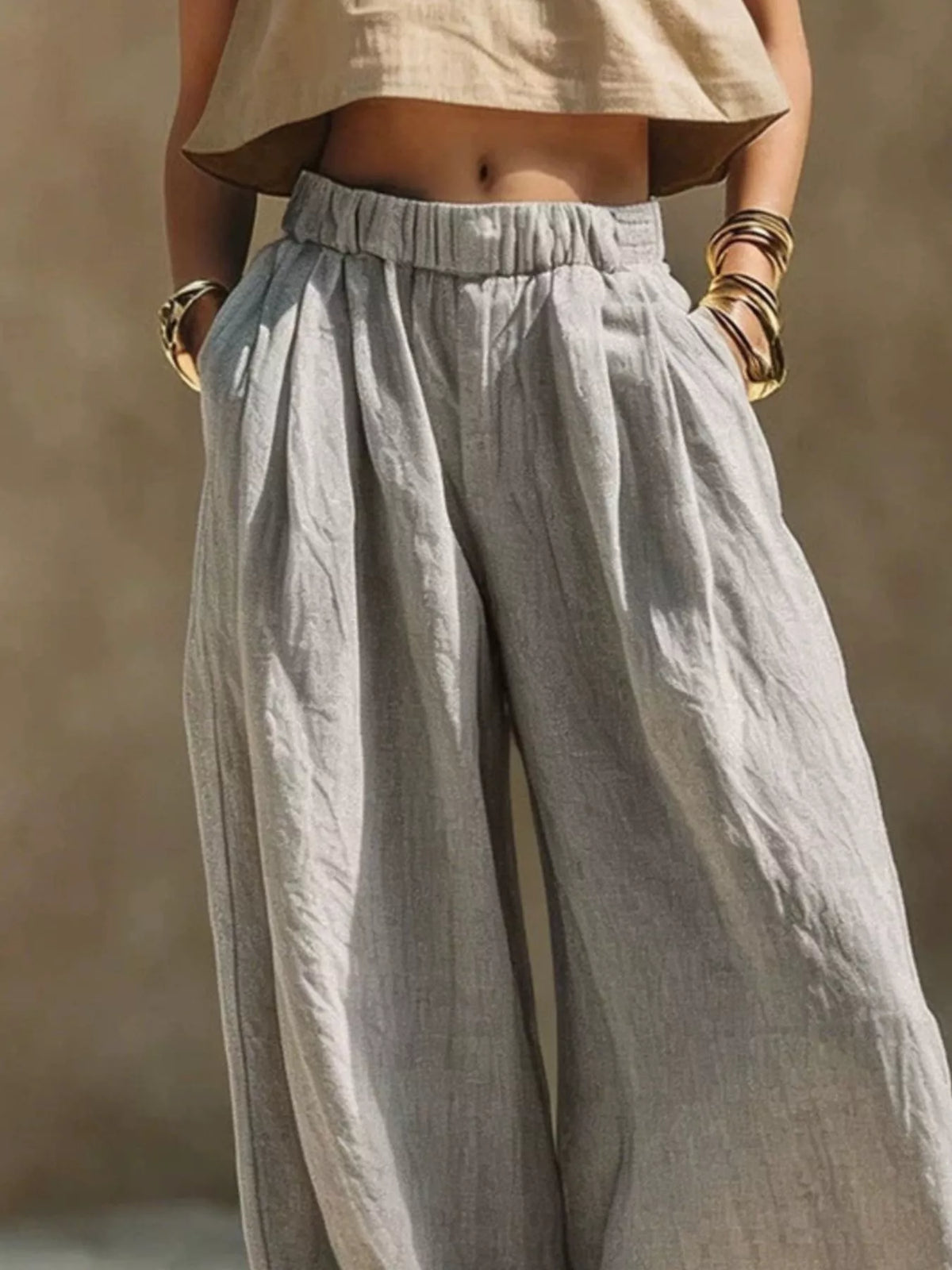 Plus size wide leg pants with full elastic waistband by Trendsi, featuring a relaxed fit and flowy fabric.