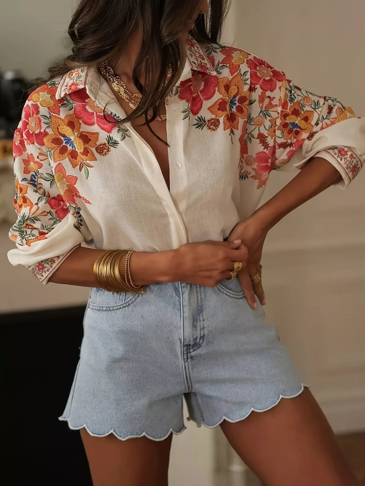 Floral print button-up shirt by Plush Fashion Hub featuring vibrant flower patterns and a classic collar style.