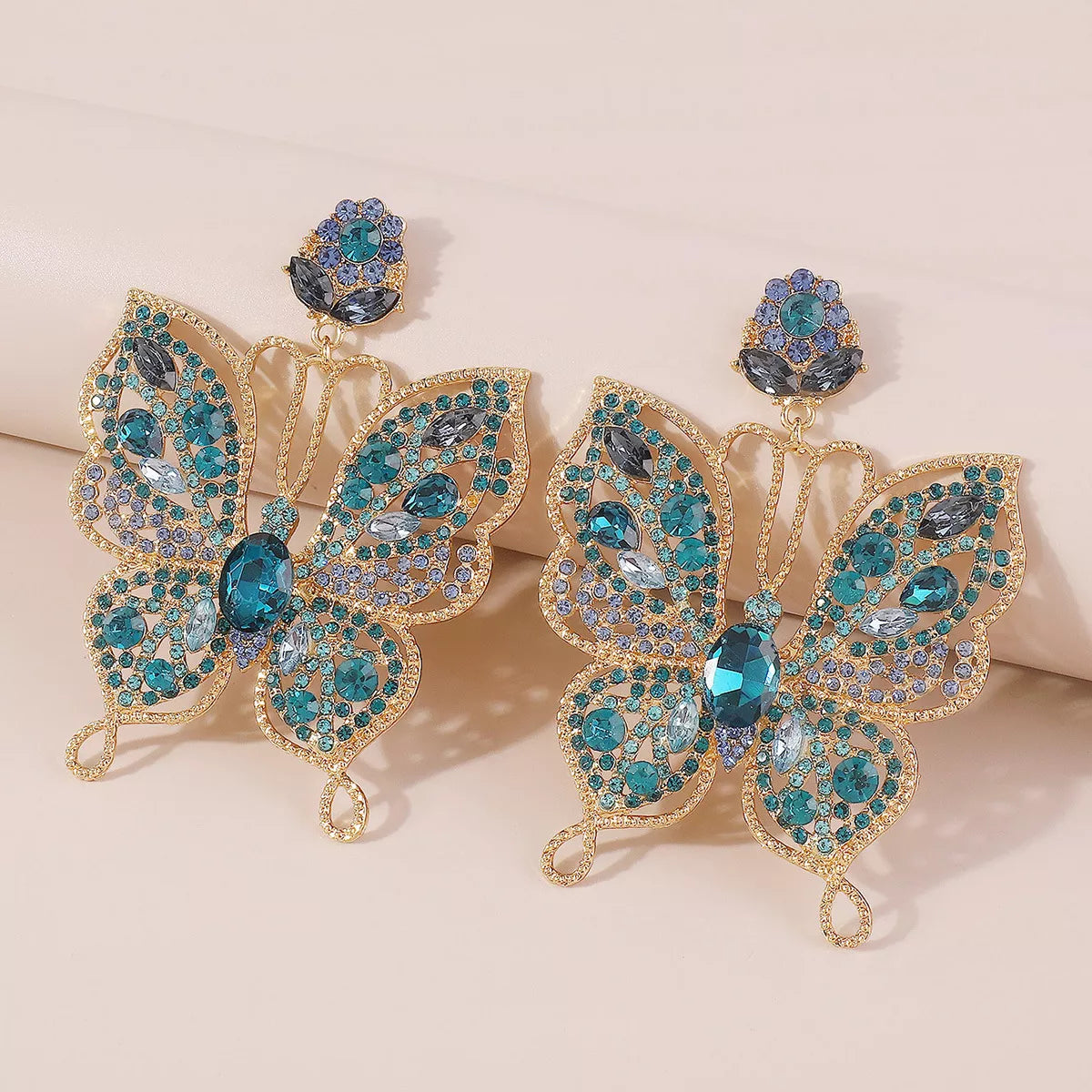 Plush Fashion Hub Butterfly Rhinestone Dangle Earrings featuring sparkling rhinestones and delicate butterfly design.