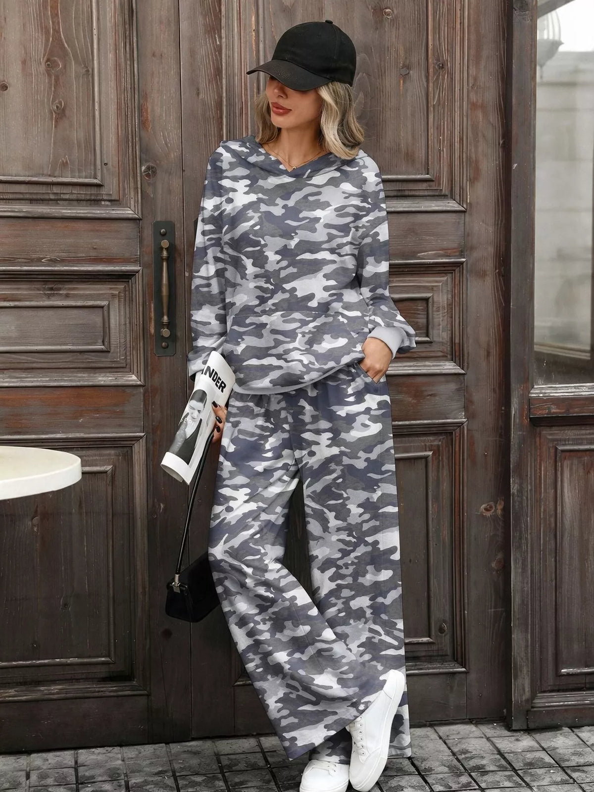 Printed long sleeve hoodie and matching pants set by Trendsi, comfortable casual wear with colorful graphic print.