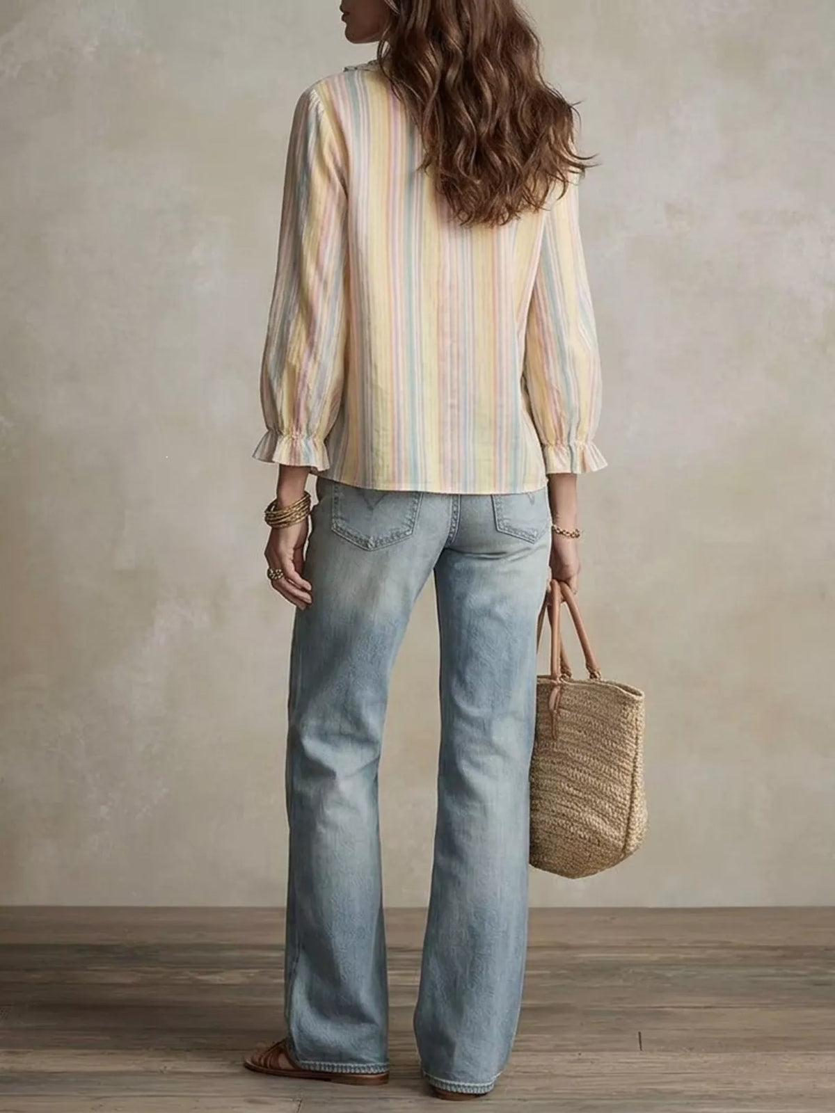 Striped ruffle-trim V-neck blouse from Trendsi featuring a stylish design and lightweight fabric, perfect for casual or dressy occasions.