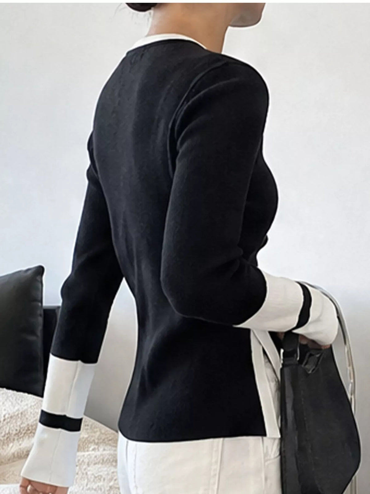 Contrast trim side slit sweater by Trendsi, featuring a stylish fit and cozy knit fabric with side slits for a modern look.