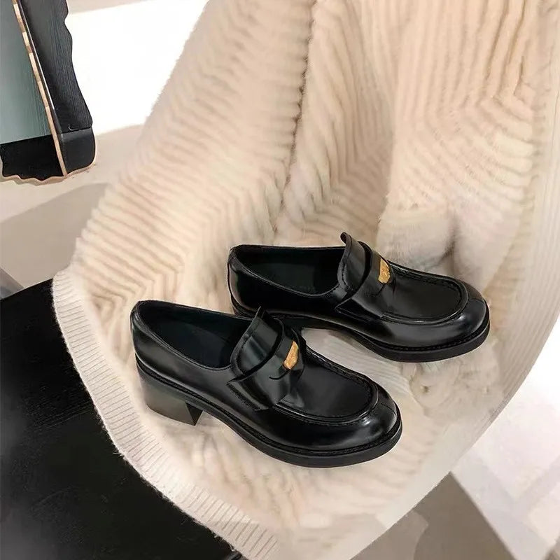 Women's round toe block heel loafers by Trendsi, stylish and comfortable shoes with a classic design and sleek finish.