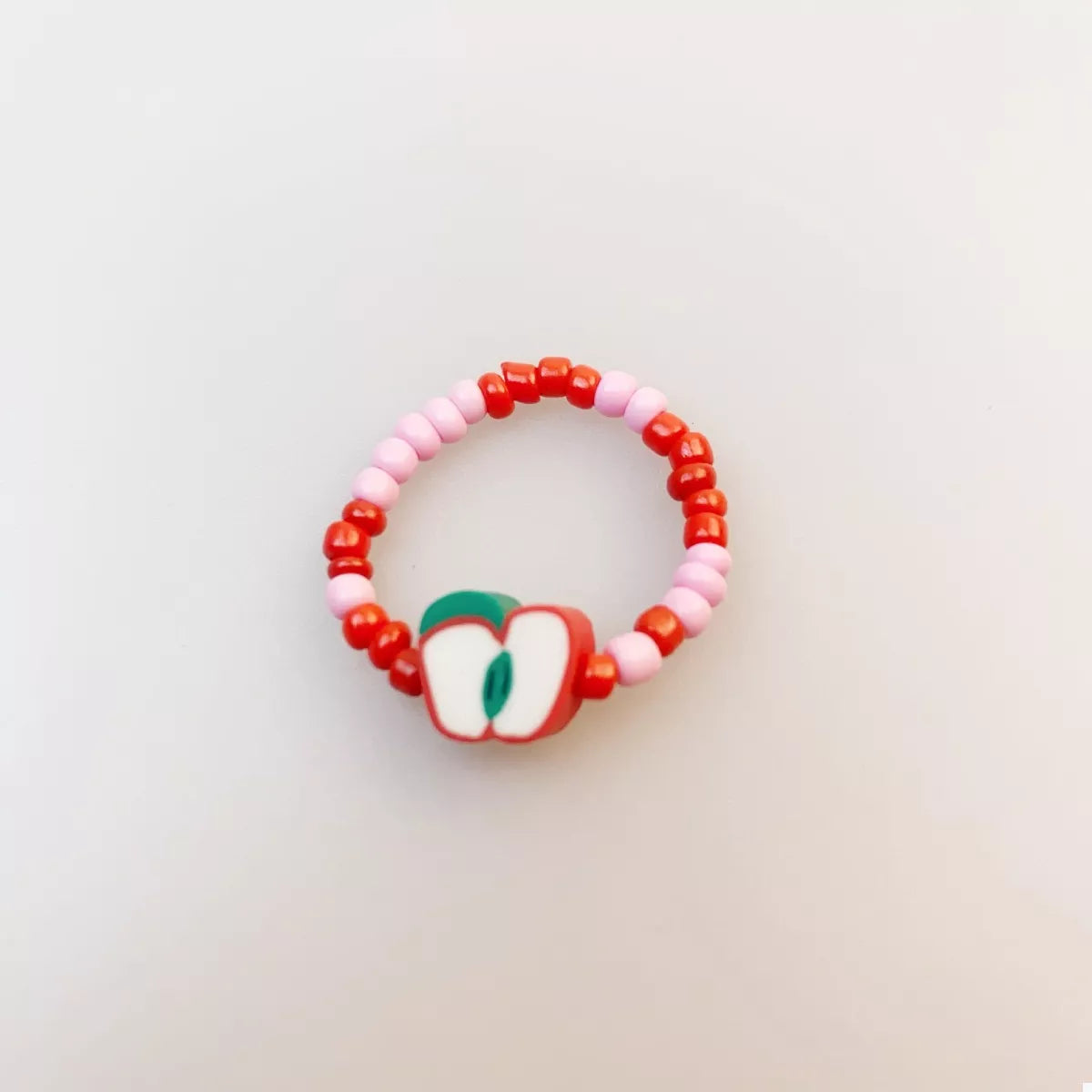 Colorful fruit charm beaded ring featuring vibrant beads and playful fruit designs, perfect for casual wear.