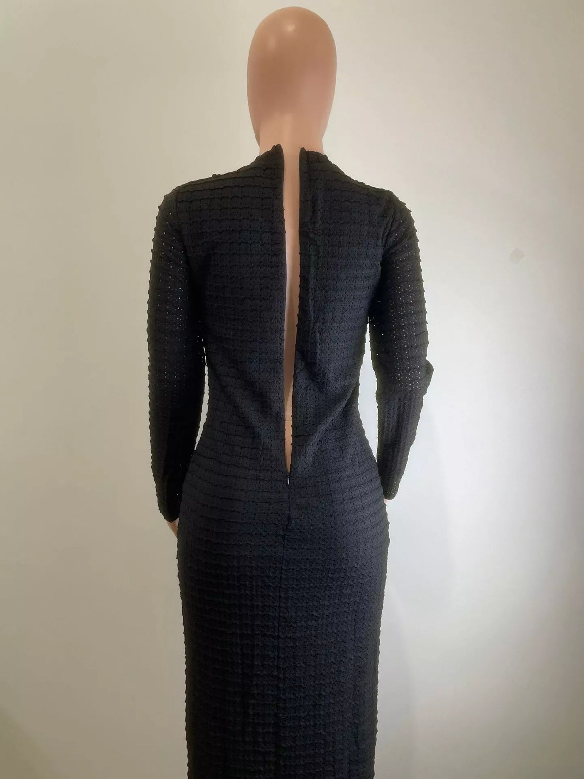 Plush Fashion Hub textured fabric button midi dress displayed on a mannequin, showcasing stylish design and elegant details.
