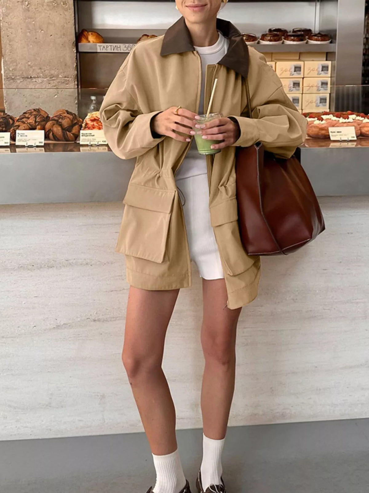 Oversized contrast collar jacket with drawstring waist, stylish outerwear by Trendsi, featuring a modern design and relaxed fit.