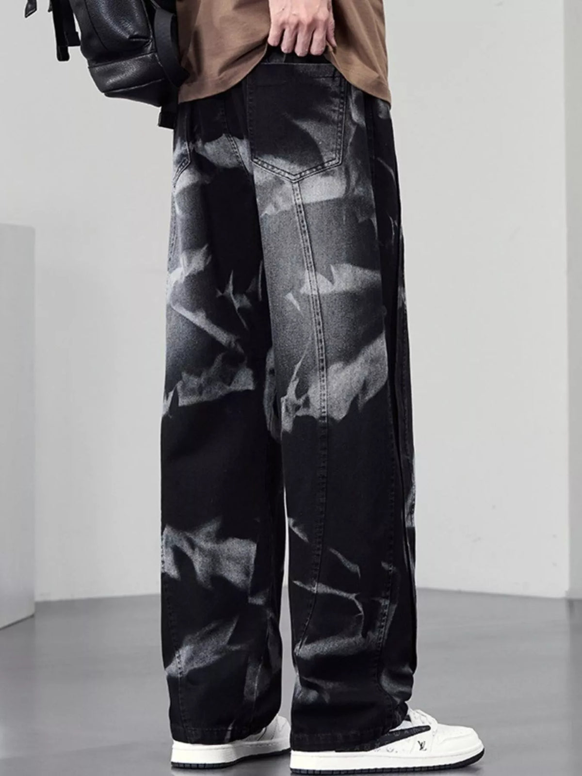 Men's plus size washed wide-leg jeans by Plush Fashion Hub, showing the relaxed fit and distressed denim style.