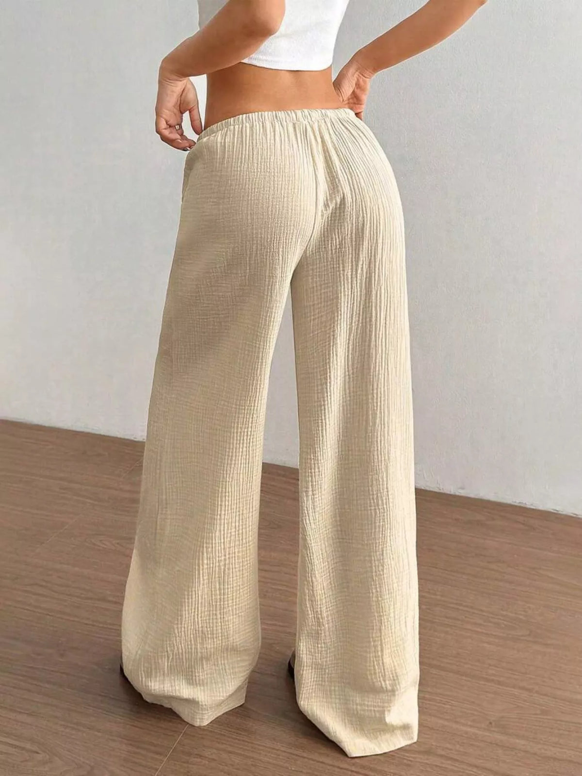 Plush Fashion Hub wide-leg drawstring pants in soft fabric, featuring a relaxed fit and adjustable waistband.
