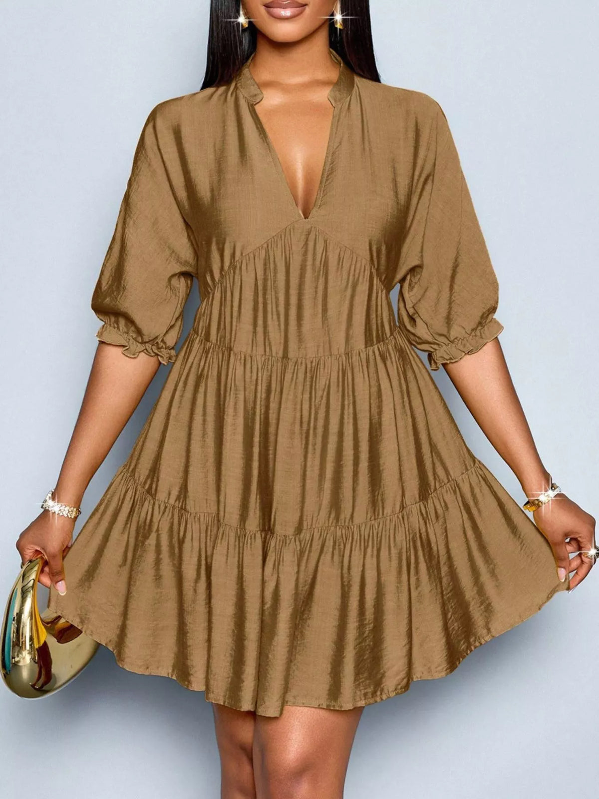 Notched half sleeve tiered dress by Plush Fashion Hub featuring a stylish design and layered fabric in a vibrant color.