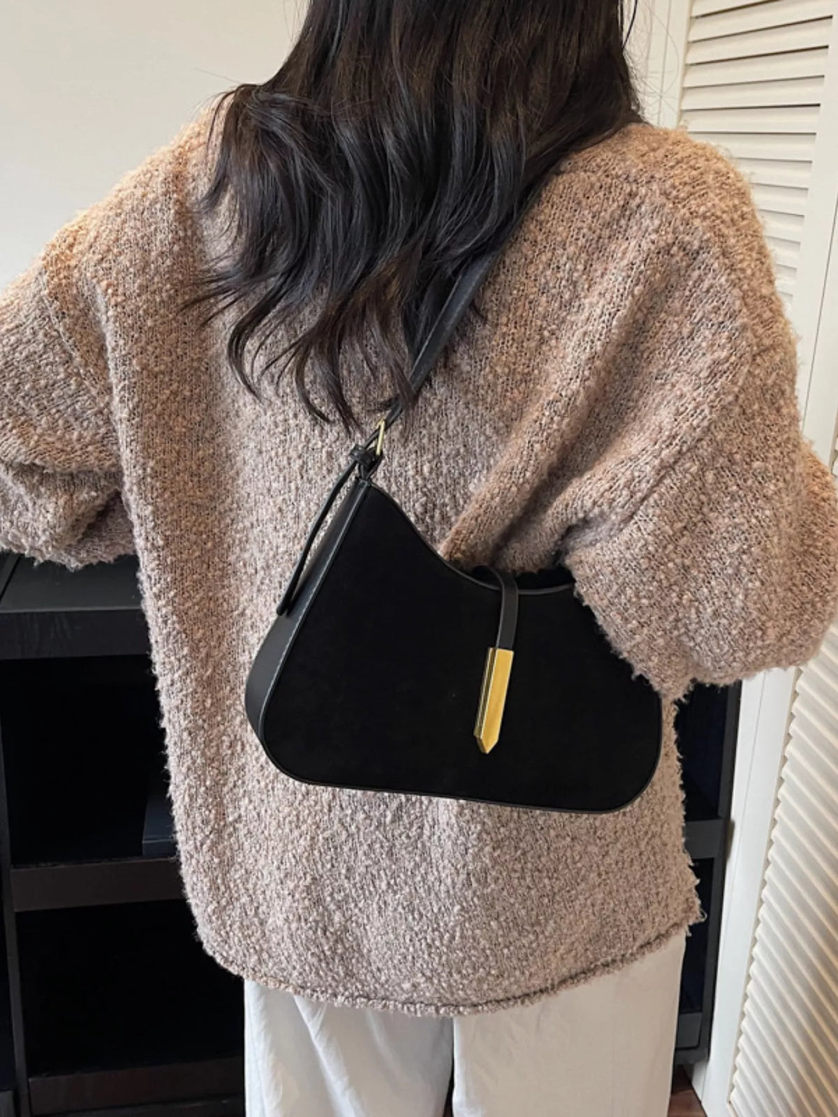 Adjustable strap shoulder bag from Plush Fashion Hub with a sleek design and spacious interior, perfect for everyday use.