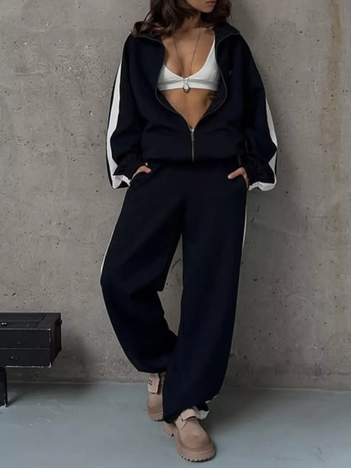 Plush Fashion Hub zip-up long sleeve tracksuit set with comfortable fabric, featuring a stylish design and matching pants for casual wear.