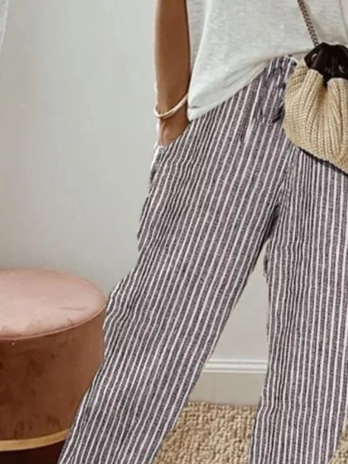 Striped cropped pants by Plush Fashion Hub featuring a stylish design with horizontal stripes and a comfortable fit.