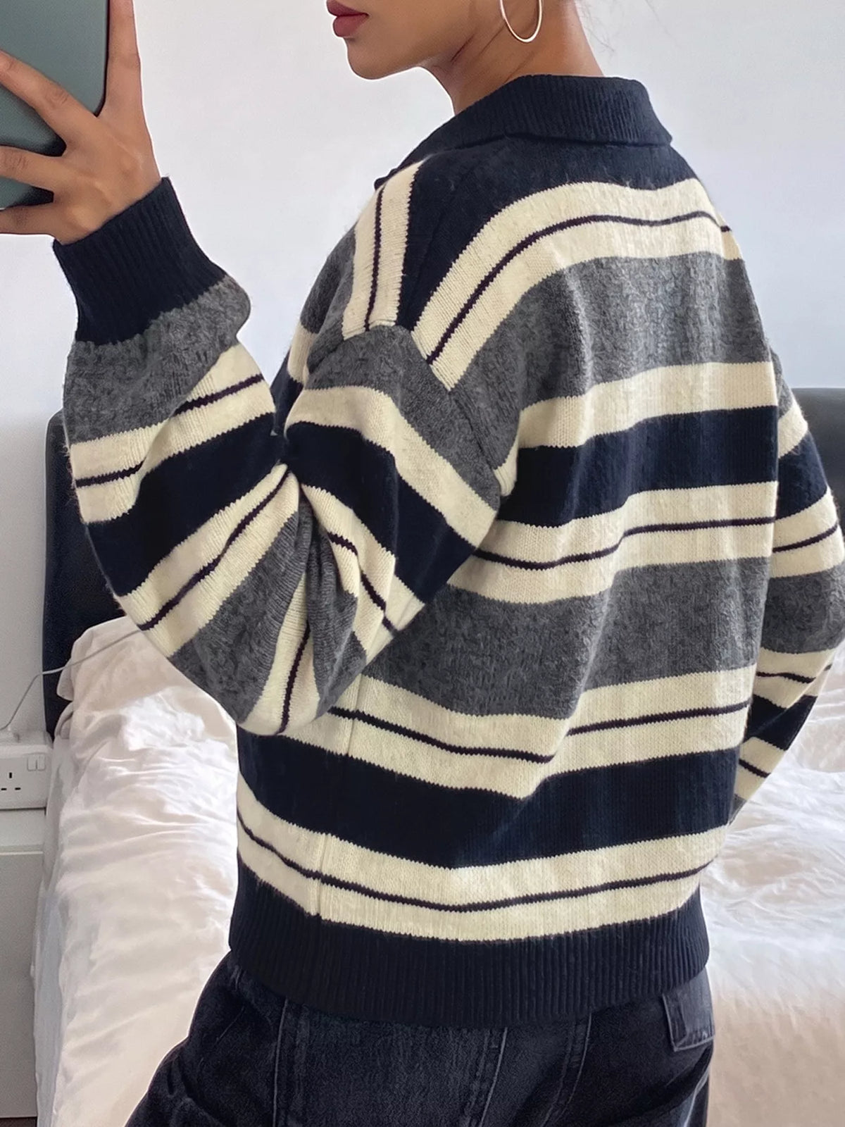 Striped long sleeve sweater with button details from Plush Fashion Hub, featuring a cozy knit design and classic striped pattern.
