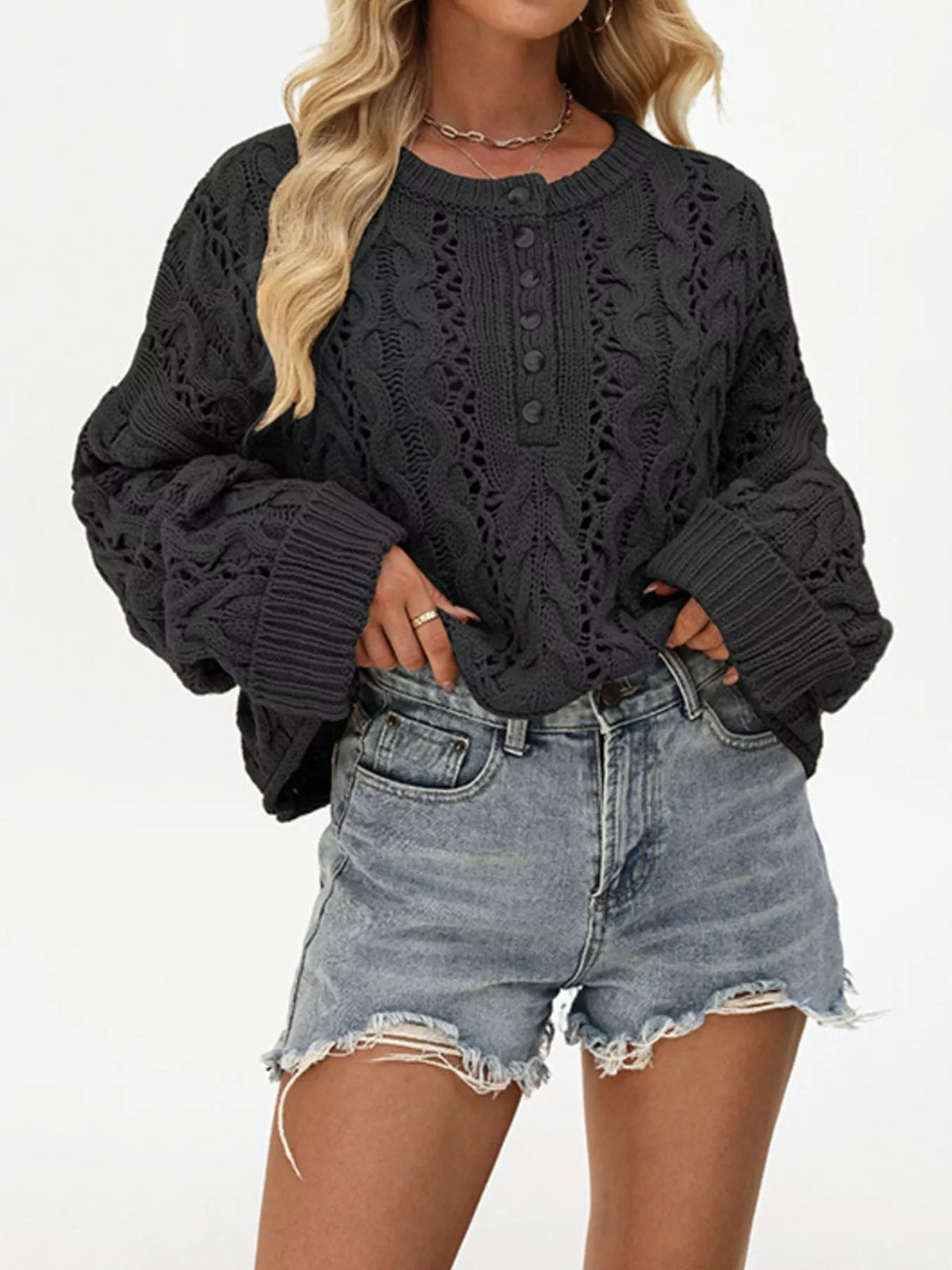 Chic cable knit half-button openwork sweater by Trendsi, featuring textured knit pattern and stylish openwork design.