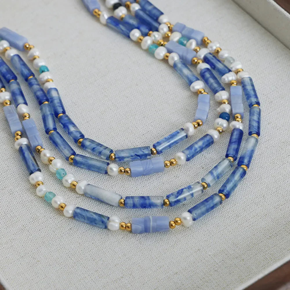 Freshwater pearl and titanium steel geometric bead necklace showing elegant beads on a sleek chain.
