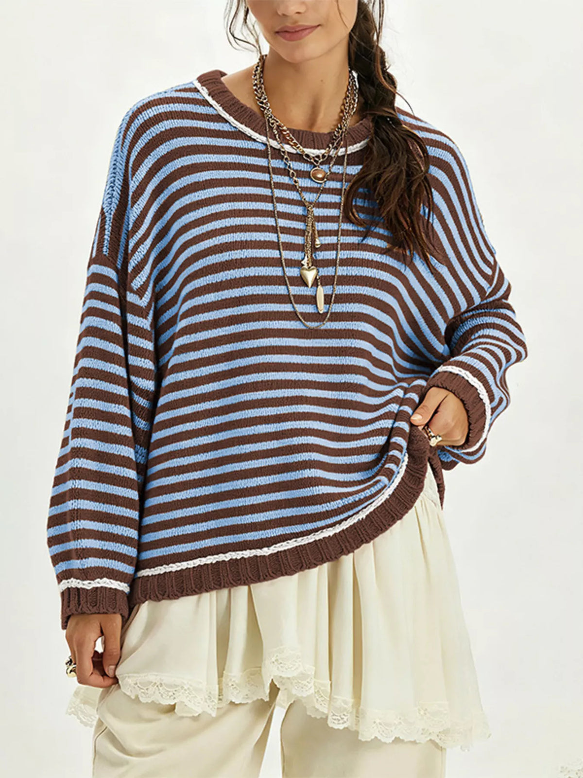 Oversized striped dropped shoulder sweater in soft knit fabric, featuring relaxed fit and bold horizontal stripes, by Trendsi.