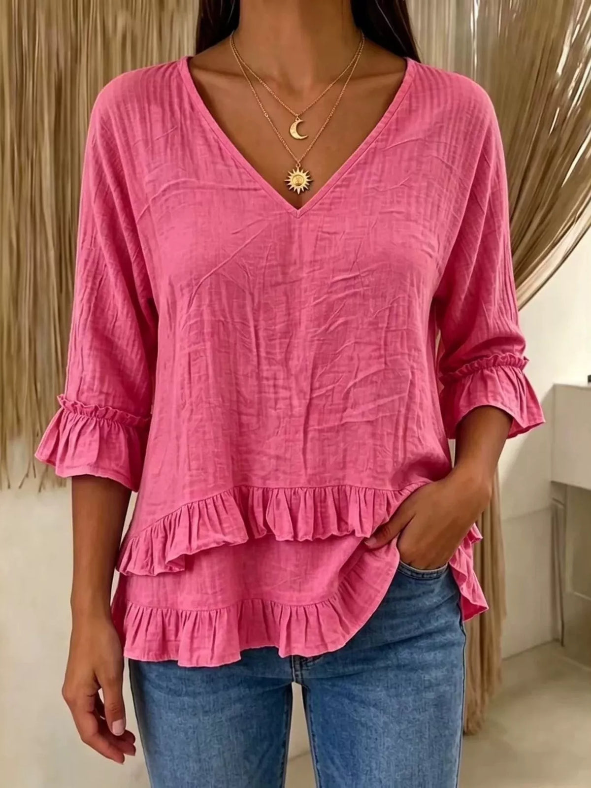 V-neck ruffle sleeve blouse from Trendsi featuring a flowy design and soft fabric, perfect for casual or dressy occasions.