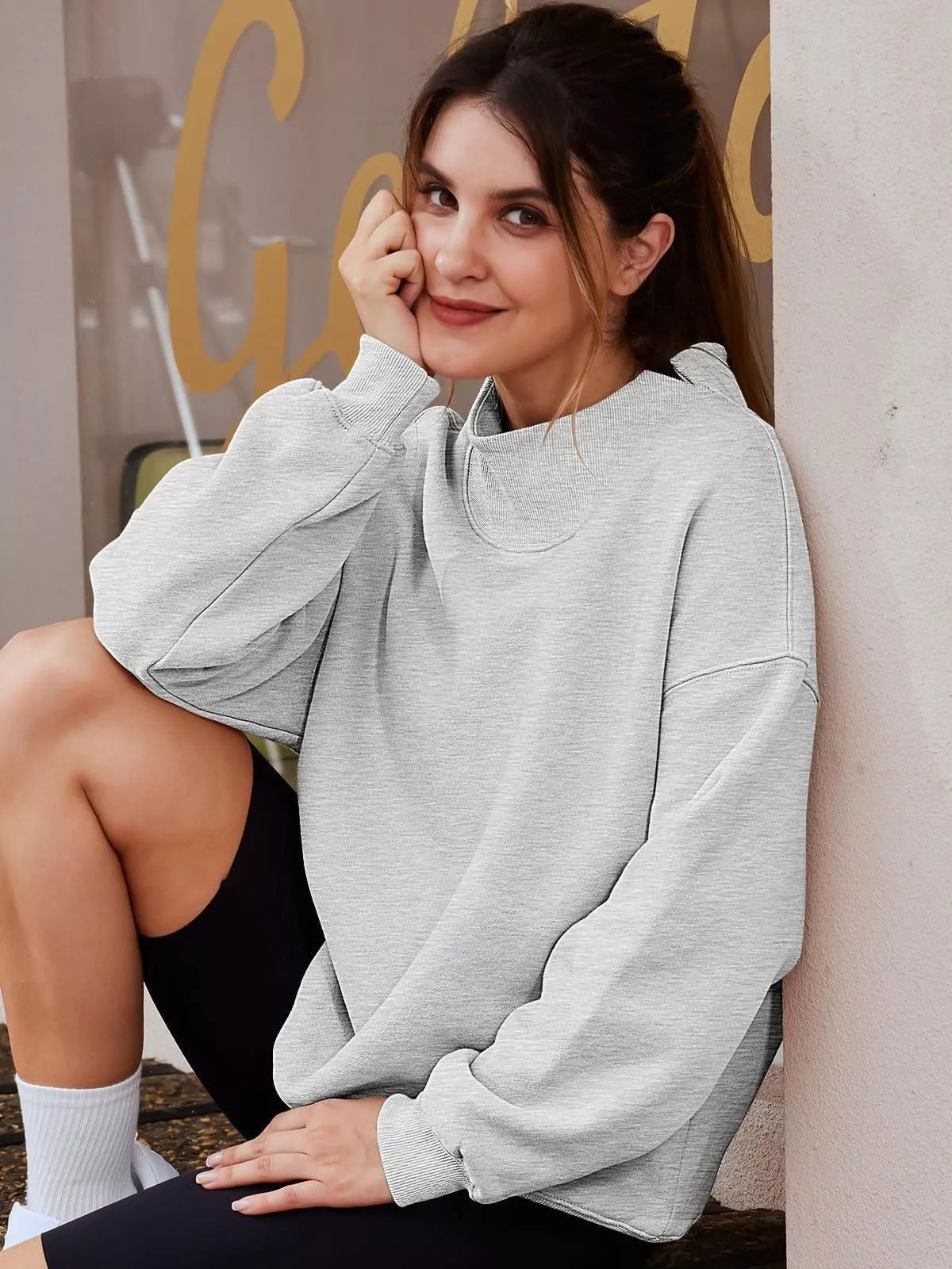 Women’s oversized plush fashion hub sweatshirt with mock neck, dropped shoulders, and casual pullover style, in soft fabric.