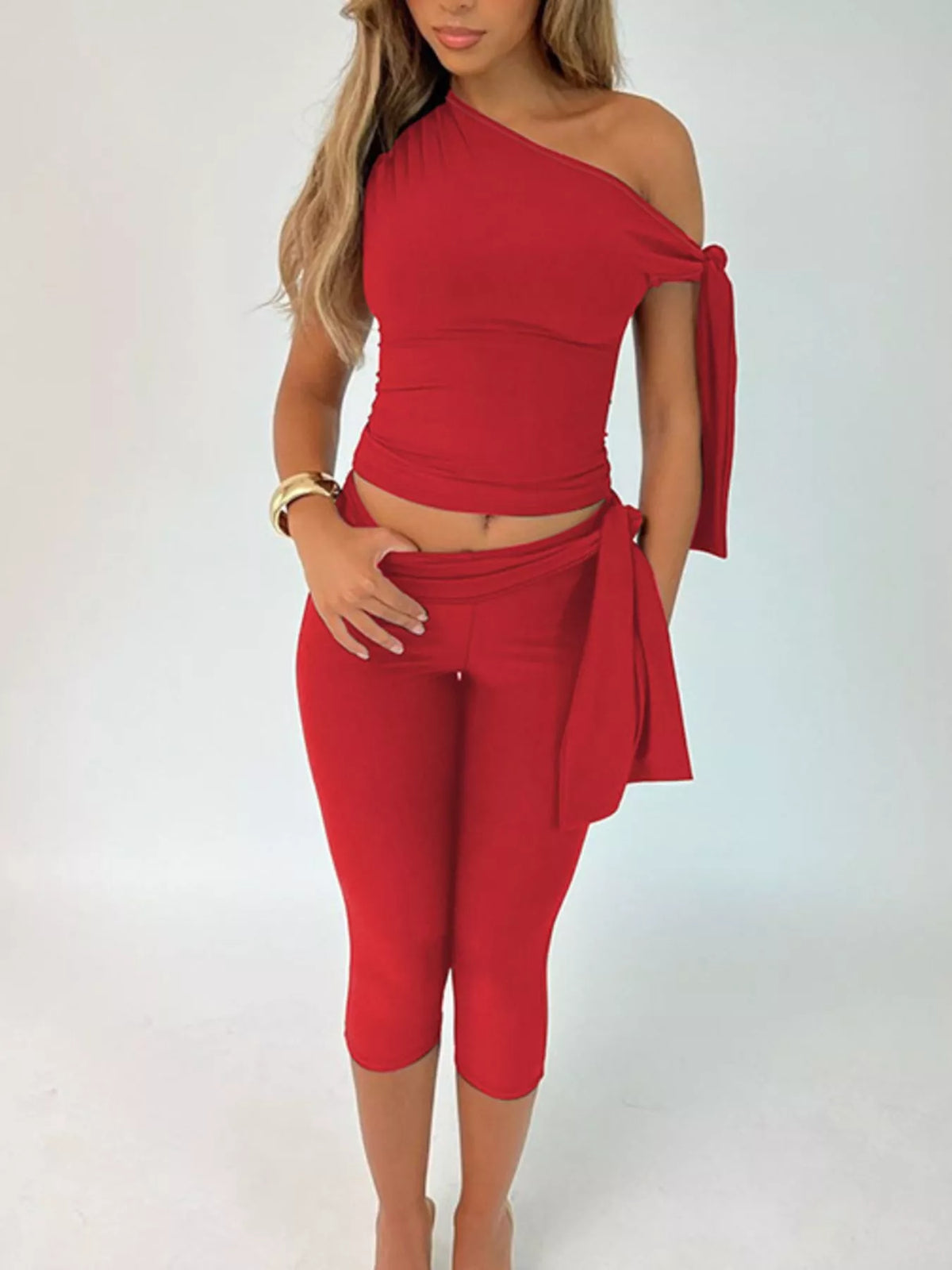 Asymmetrical one-shoulder top and matching capris set in soft fabric, by Plush Fashion Hub, shown on a model.