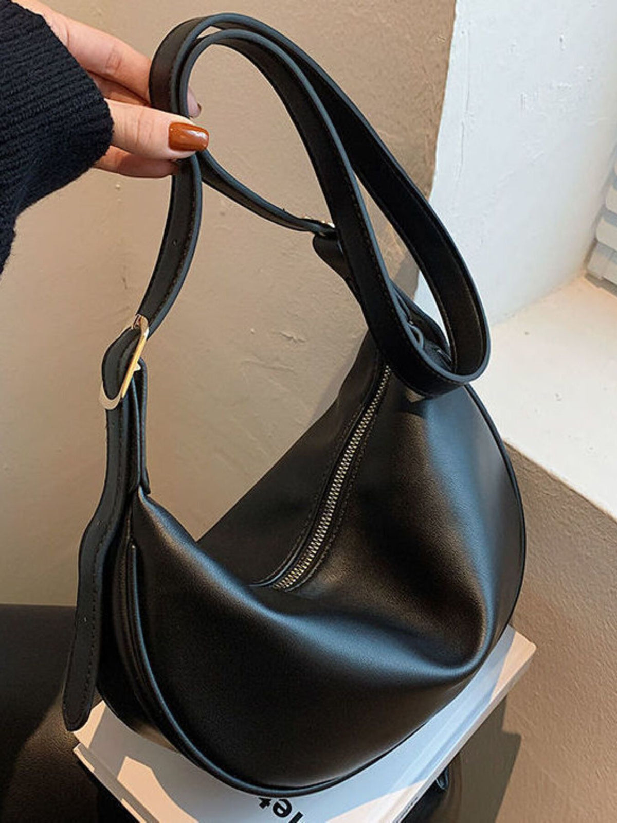 Minimalist crescent crossbody bag in smooth PU leather, stylish and compact, by Plush Fashion Hub.