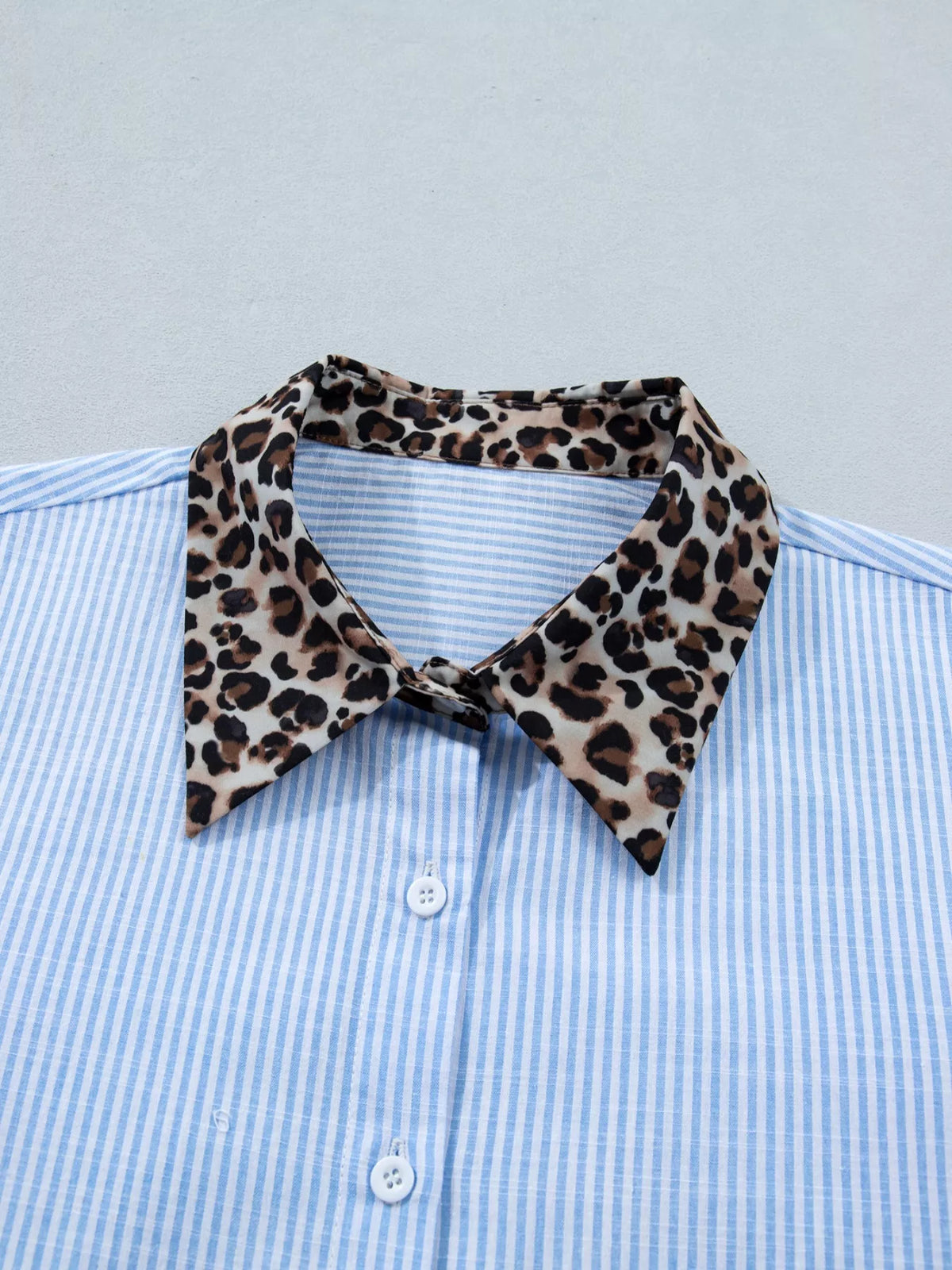 Women's leopard print short sleeve dress with contrast collar by Plush Fashion Hub, showing the stylish dress with leopard pattern and collar detail.