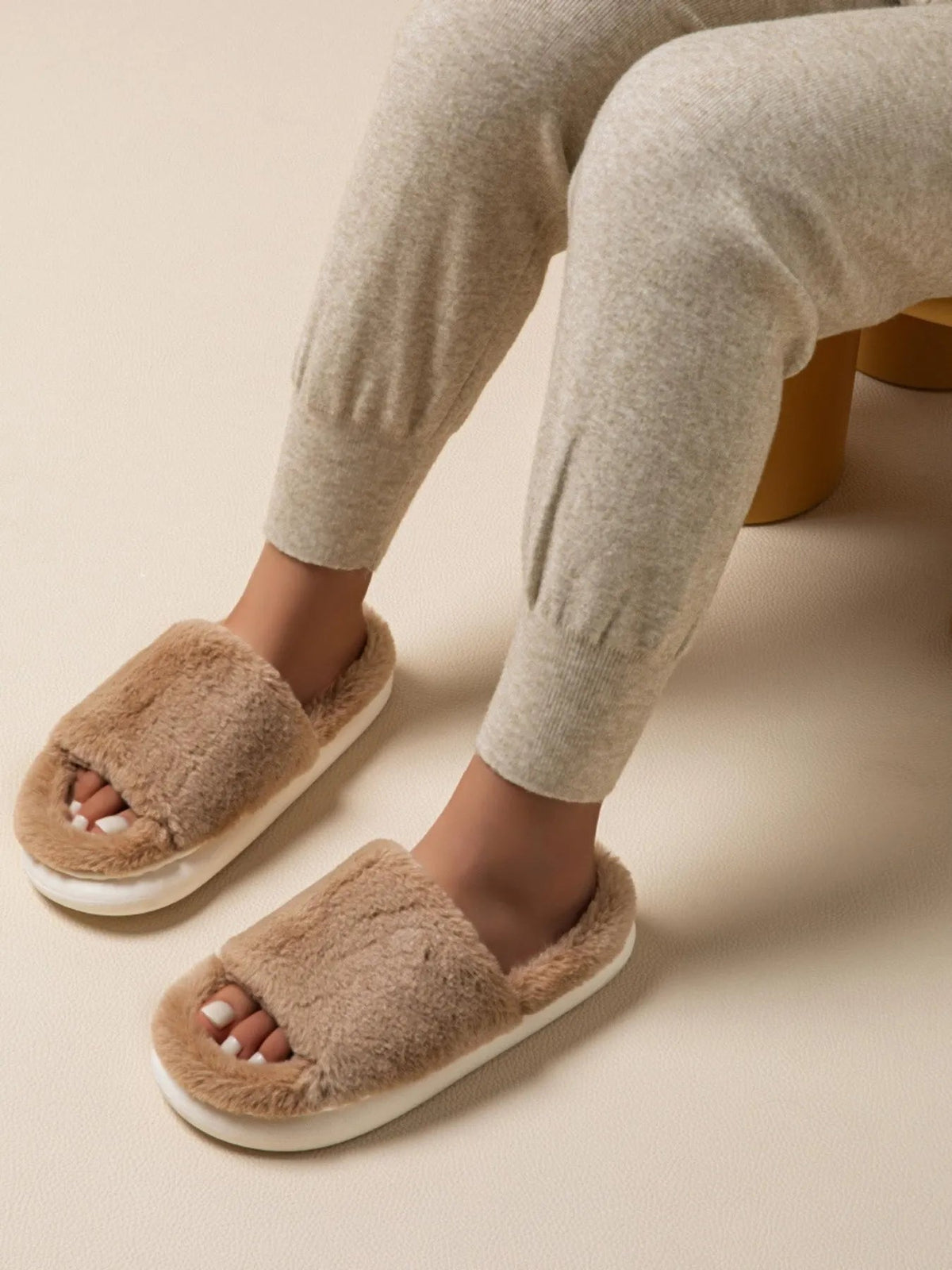 Fluffy open-toe faux fur slippers for women, soft indoor house shoes with plush comfort from Plush Fashion Hub