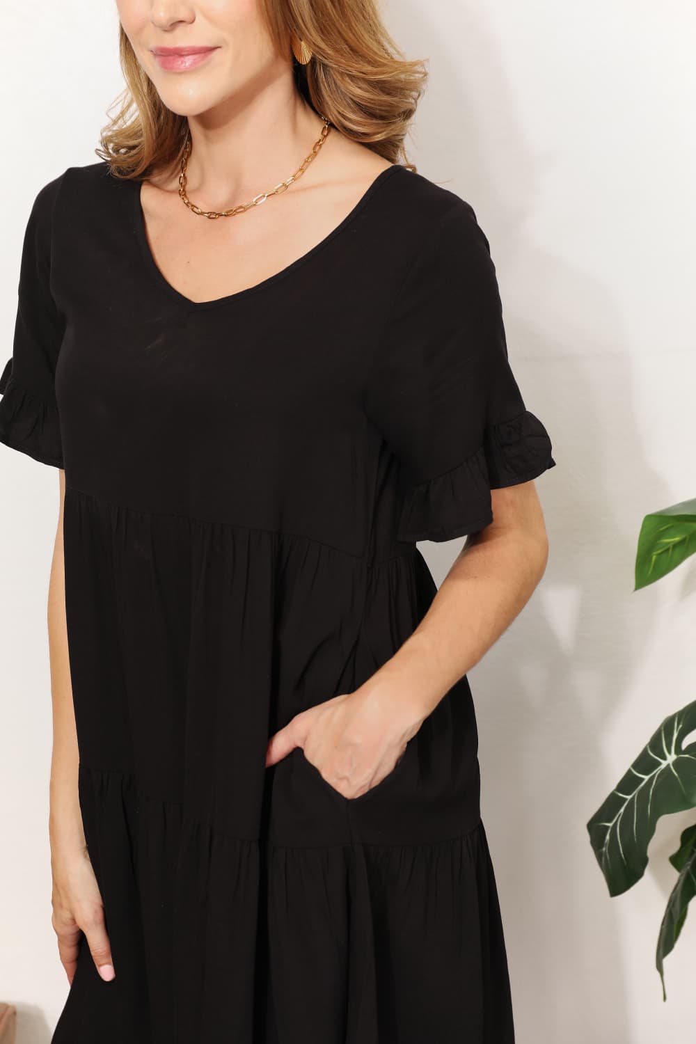 Women's Mandy solid V-neck tiered casual dress with flounce sleeves by Plush Fashion Hub, shown in a relaxed fit style.
