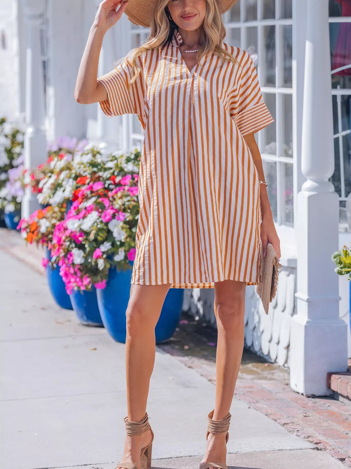 Striped V-neck mini dress by Plush Fashion Hub featuring turn-up cuffs and side pockets, perfect for casual or summer wear.