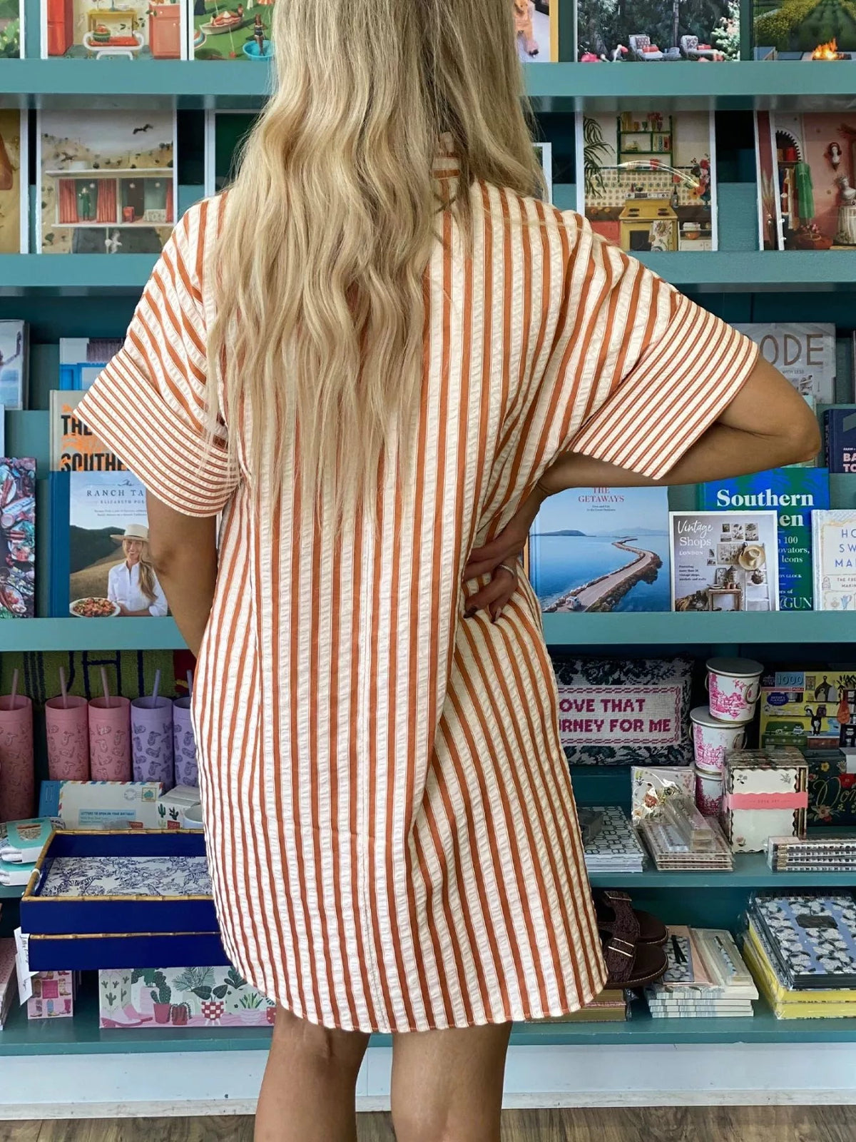 Striped V-neck mini dress with turn-up cuffs and pockets by Plush Fashion Hub, showcasing a stylish and casual design.