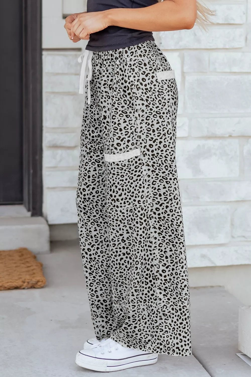 Women’s animal print wide-leg terry knit pants with drawstring waist, stylish and comfortable lounge pants from Plush Fashion Hub.