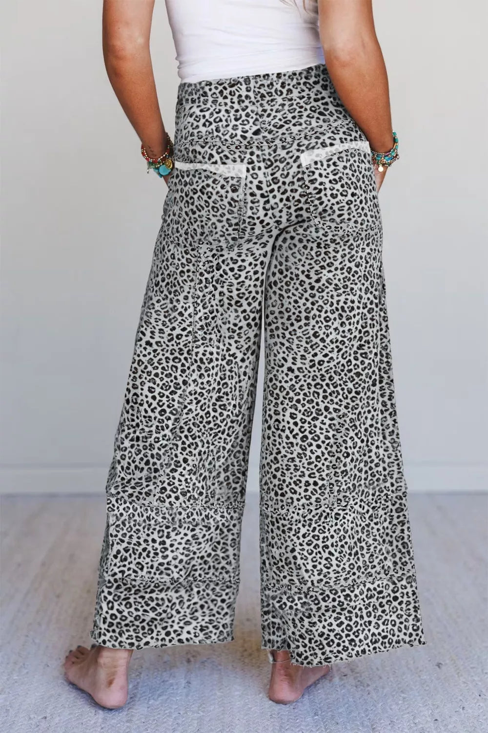 Women’s animal print wide-leg terry knit pants with drawstring waist from Plush Fashion Hub, featuring comfortable, stylish loungewear design.
